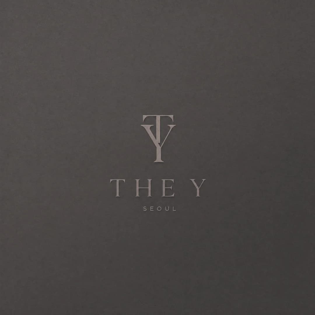 THE Y brand mark